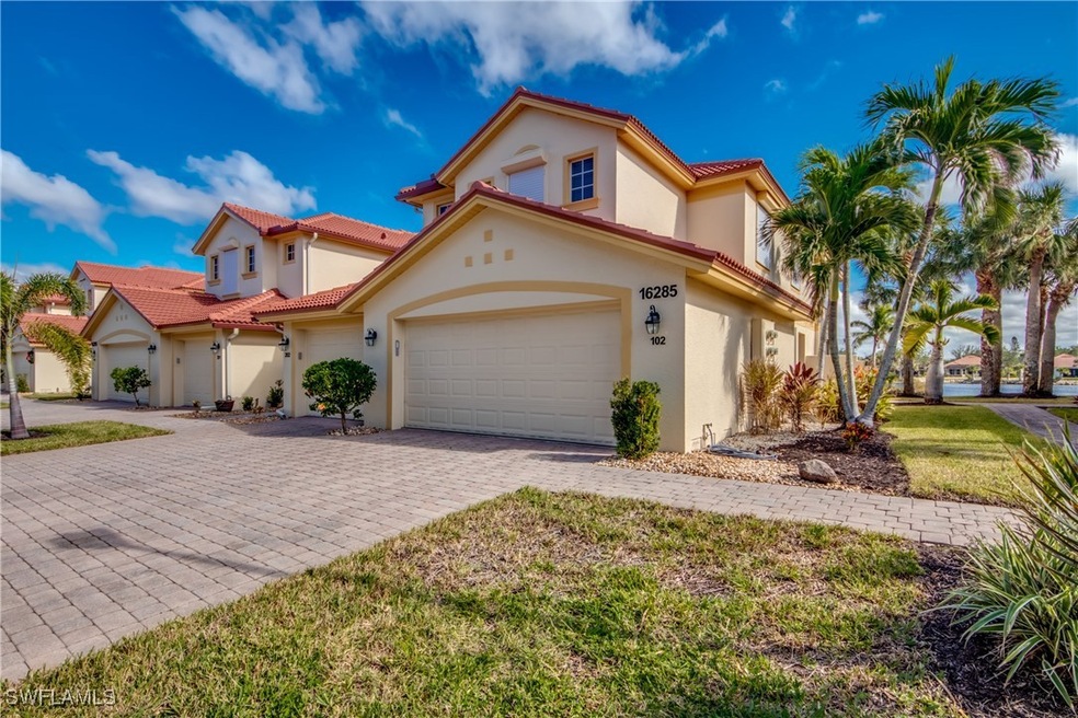 Front of building view with 2 car garage