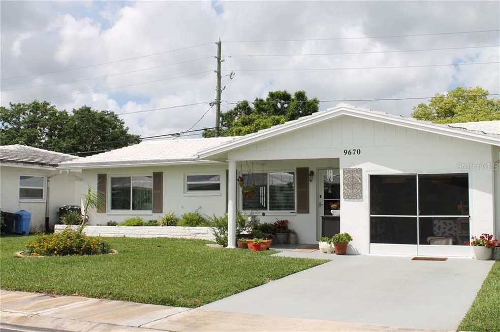 Front of Home with Screen Garage Door for Cross Br