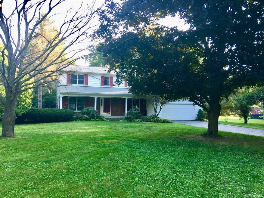 Four Bedroom, 2.5 bath home on tree lined lot.