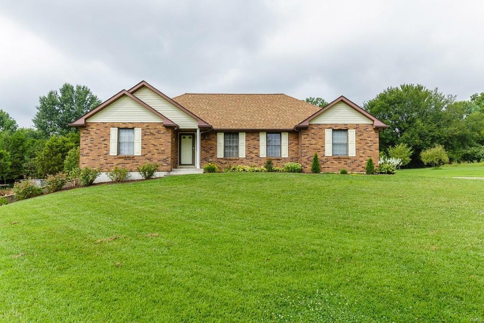 11 Graystone Drive. 3 sided brick ranch home with 