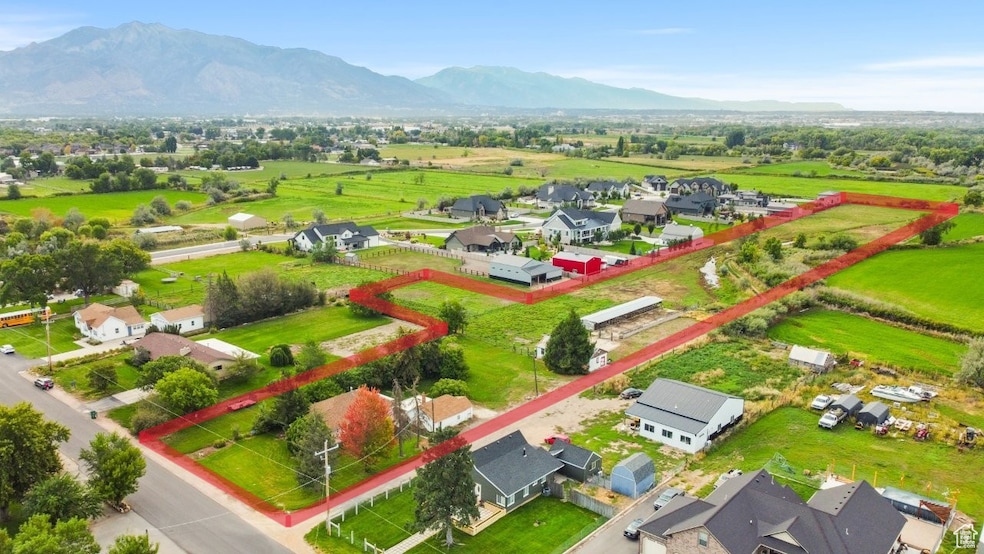 Aerial view of residential area featuring a mountain backdrop