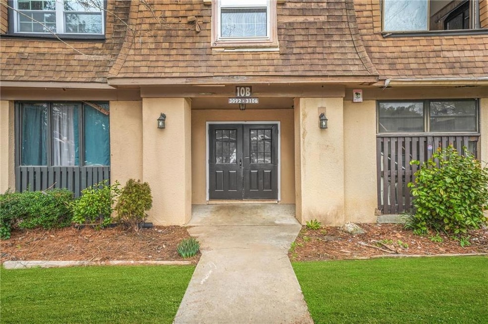 Property entrance with a lawn