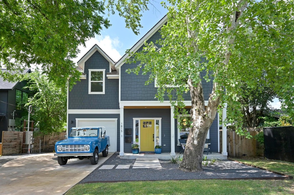 View of front of house featuring concrete drivewa