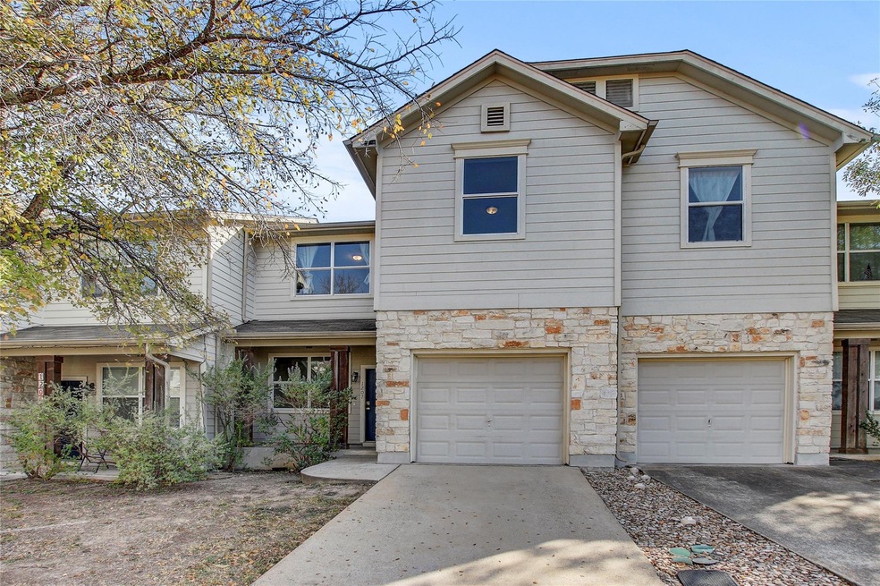 View of front of house with concrete driveway, an