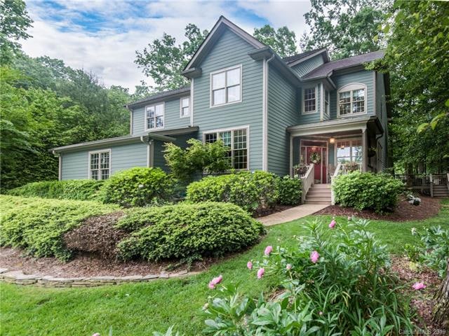Absolutely stunning home nestled amongst woods and