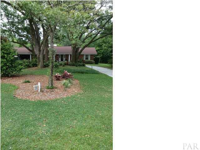 Front of the home boasts a circular driveway