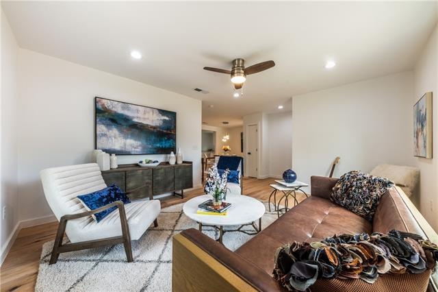 With sight lines into the dining room and kitchen,
