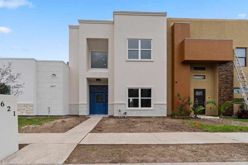 View of front of property featuring stucco siding and stone siding