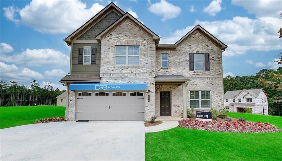 Craftsman house with a front yard and a garage