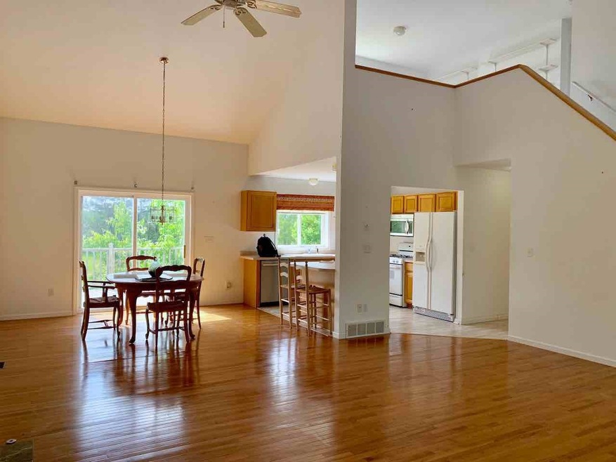Living, dining with beautiful hardwood flooring, g