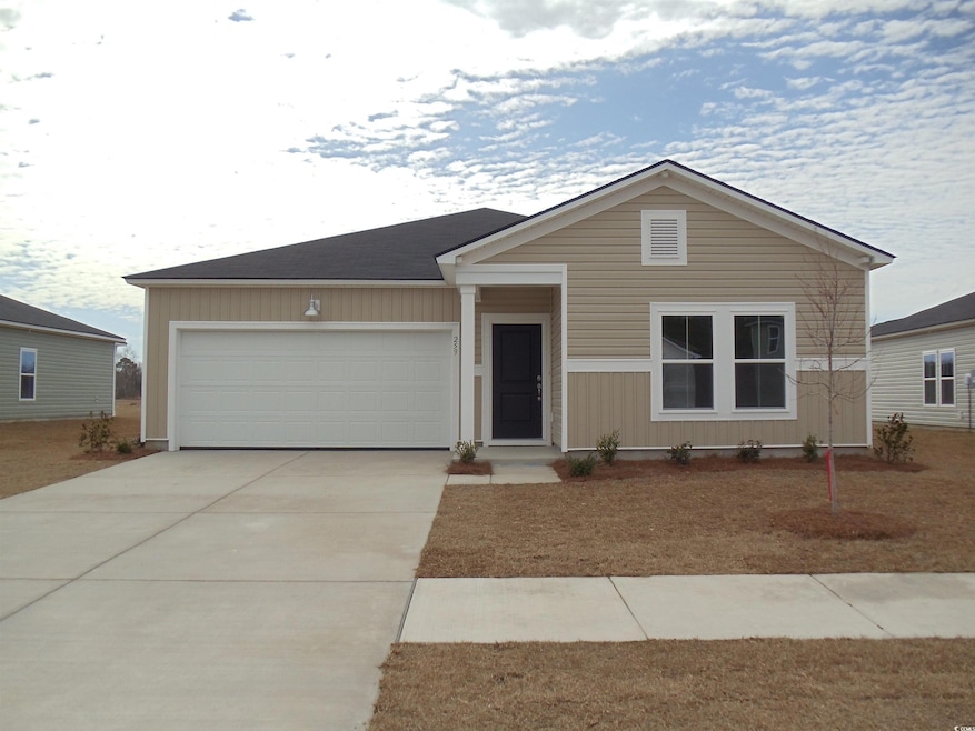 Ranch-style home with concrete driveway and an att