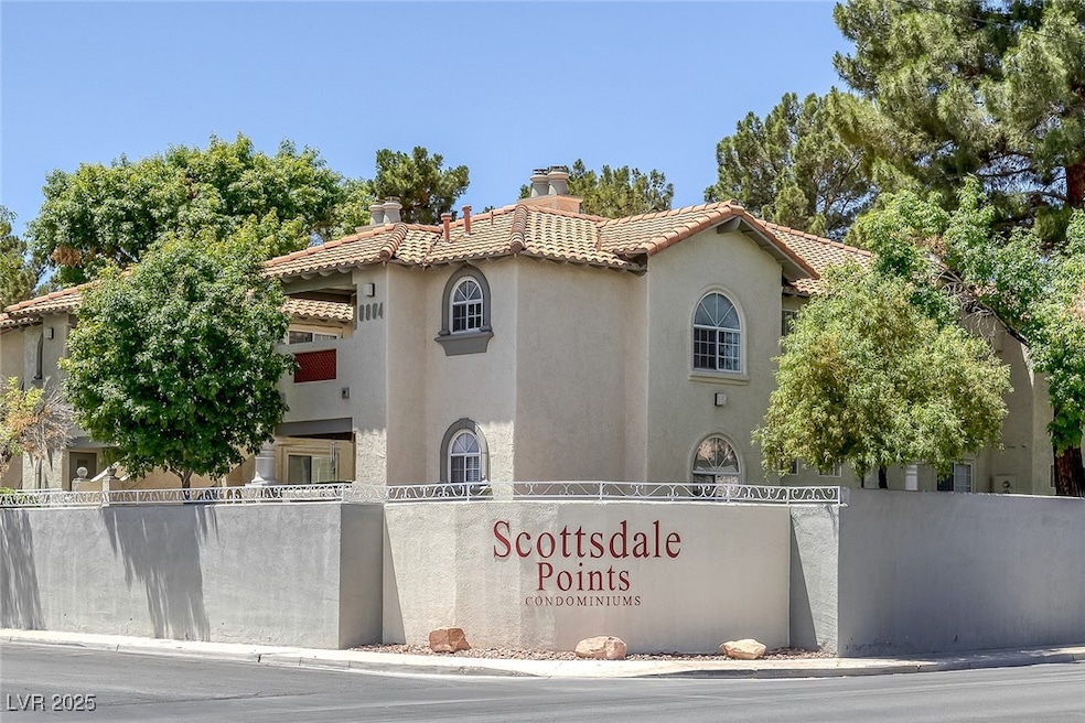 View of front of house with stucco siding, a chimn