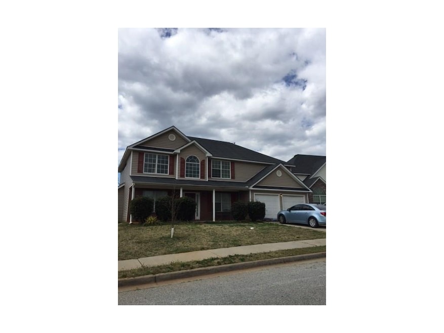 Front exterior, Brick on the porch portion, Vinyl 