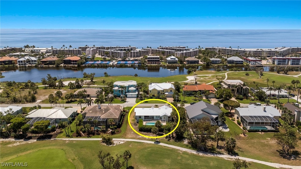 Aerial view of residential area featuring a golf c