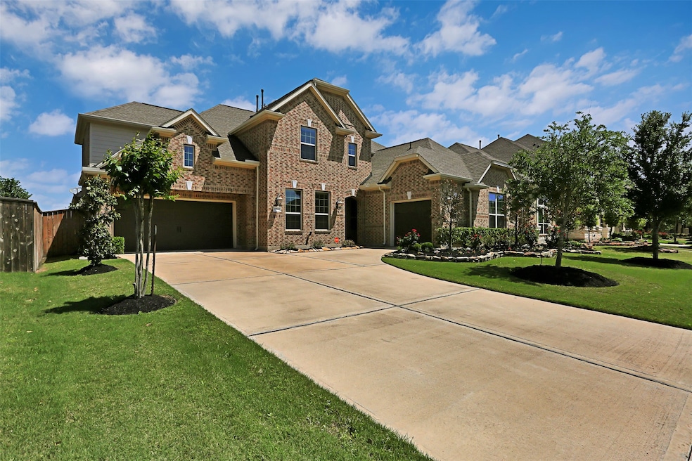 This stunning Cinco Ranch home also has automated exterior lighting!