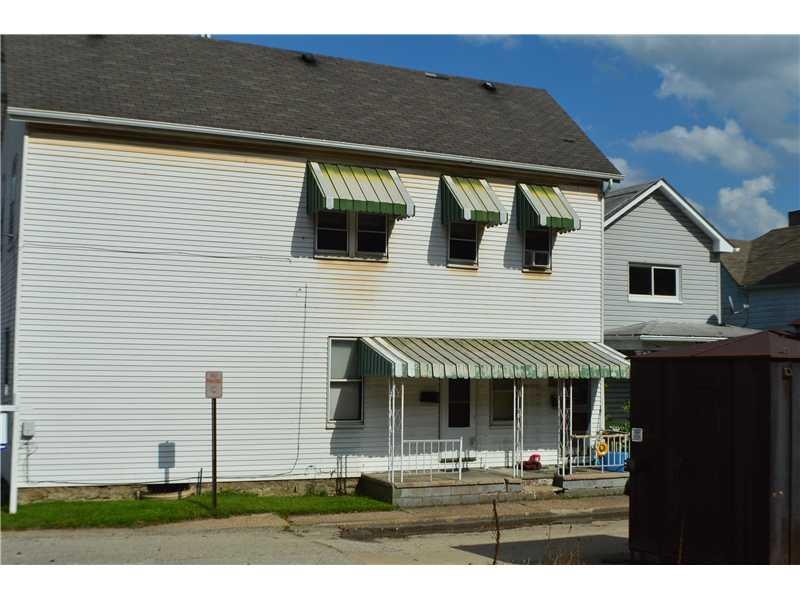 Exterior Front. Entrance to upper and lower units
