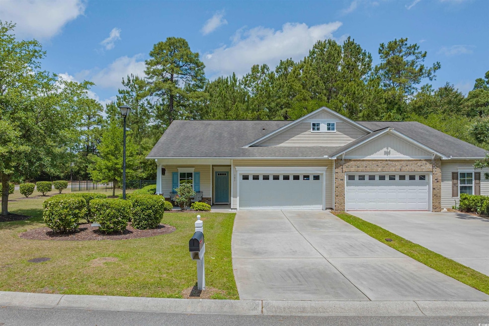 View of front of property with concrete driveway, 