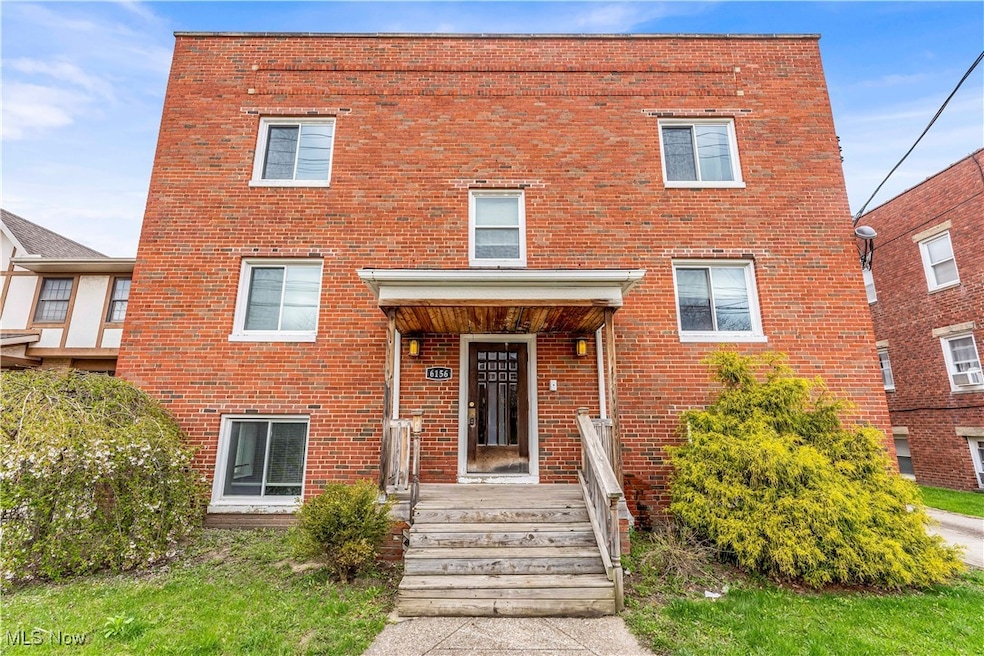 View of front of house with brick siding