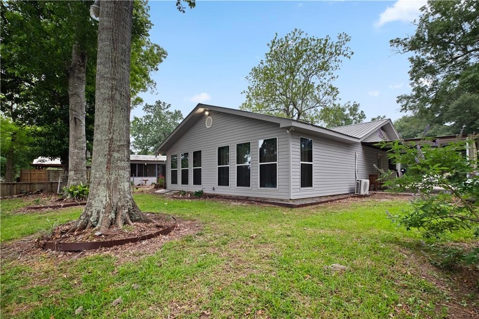 Rear with windows overlooking the bayou