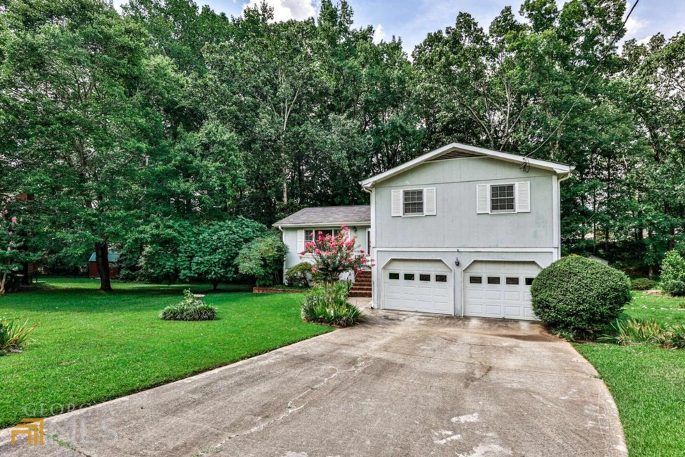 1460 Falconhurst Ct SW, Lilburn, GA 30047 - photo 1