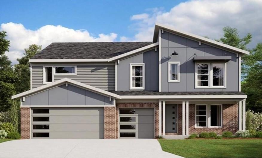 View of front of house with a garage and a front l