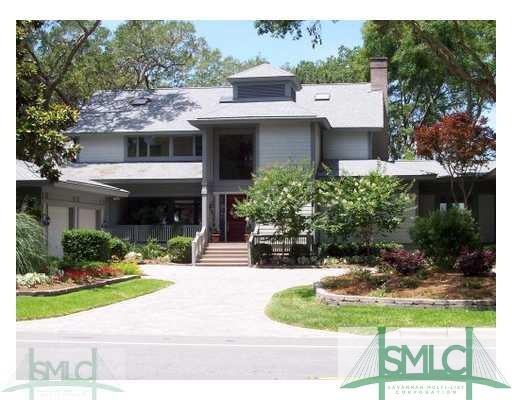 Exterior Front. Paver circular drive creates a cas