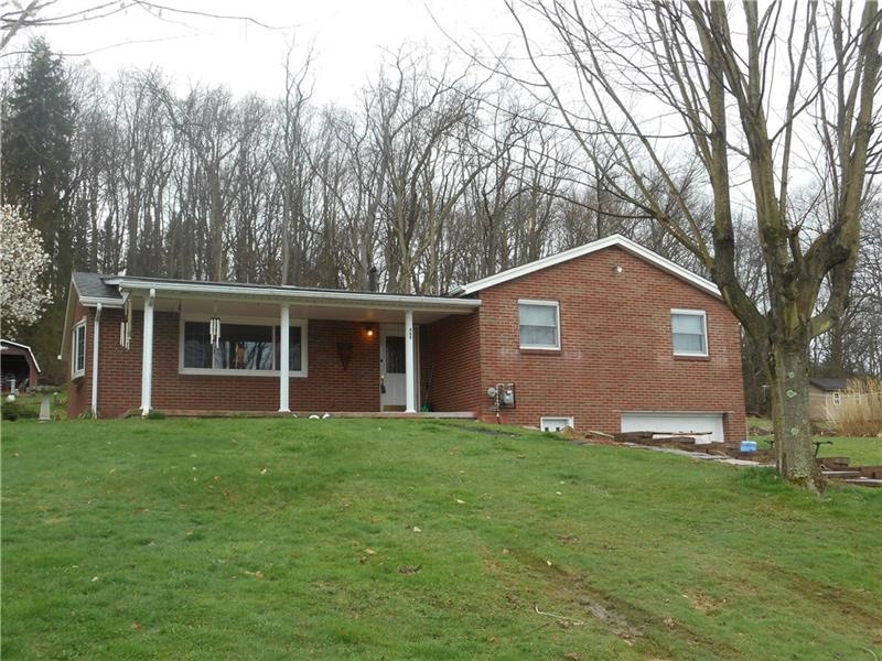 Brick ranch with integeral garage.
