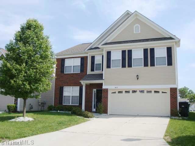Exterior Front. Front of home shows a lovely yard and nice wide driveway for plenty of parking