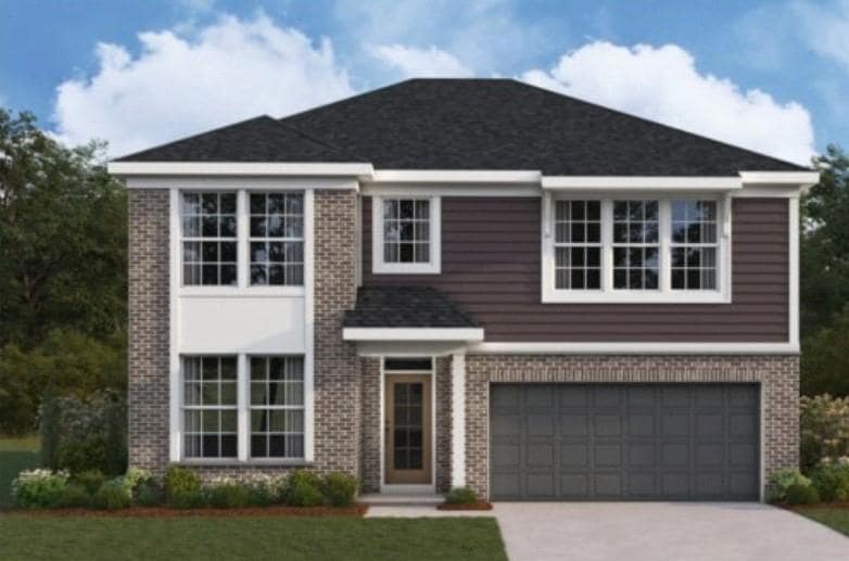 View of front of home featuring a garage, driveway