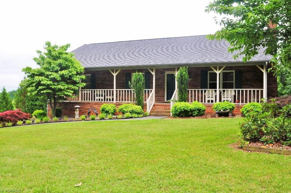 6899 Belews Creek Road in Belews Creek, NC 27009 Brick ranch features 3 bedrooms, 3 baths, kitchen and breakfast area opens to large deck overlooking beautiful lawn, living room w/fireplace. Basement features den with brick fireplace, kitchen, and full bath. Two storage area unheated for work shop or storage. .77 acres