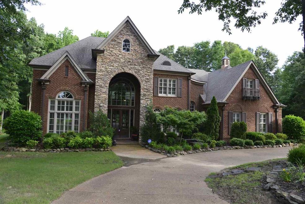Beautiful, brick home sits on 1.2 acre lot in back