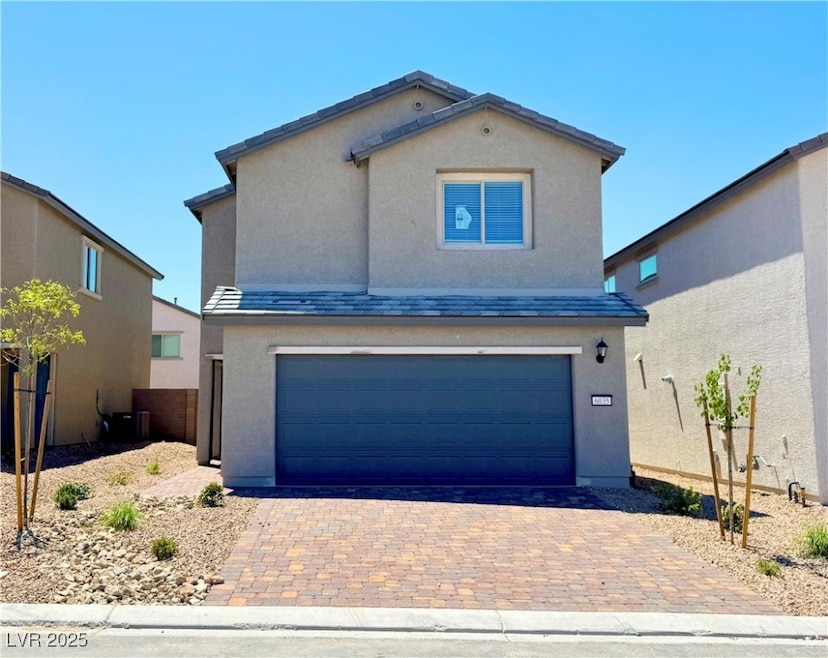 View of front facade featuring stucco siding, an a