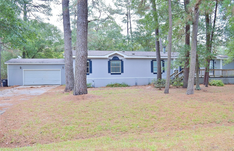 Front of home showing 2 car attached garage with access to home