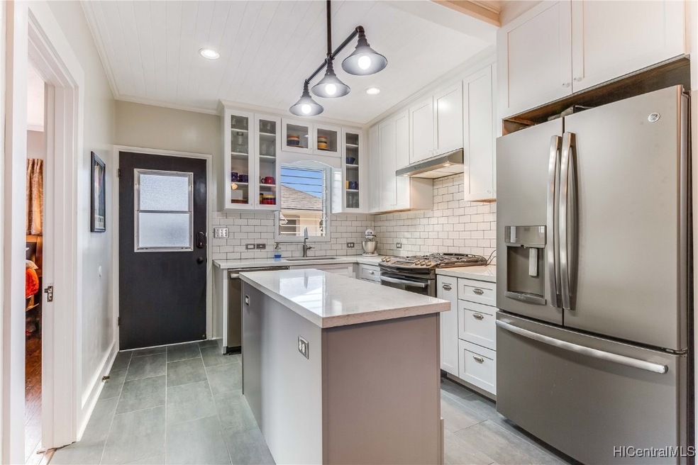 Updated kitchen with convection oven, gas stove, overhead lighting and newer appliances. Back door leads to the yard/common area.