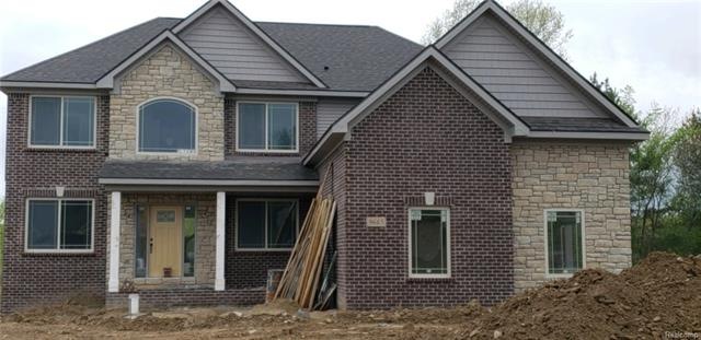 Home almost complete sidewalk and drive coming nex
