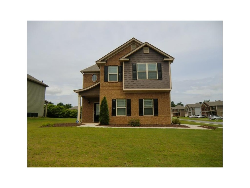 Front Of Home With Covered Entry On A Level Corner