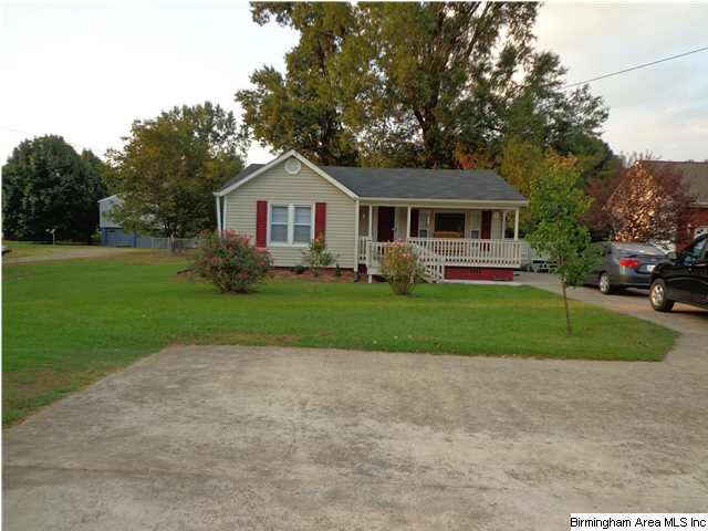 Front of house showing large yard, drive and turn 
