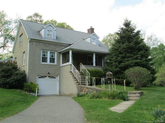 Stucco Cape on 7.9 acres with covered front porch,