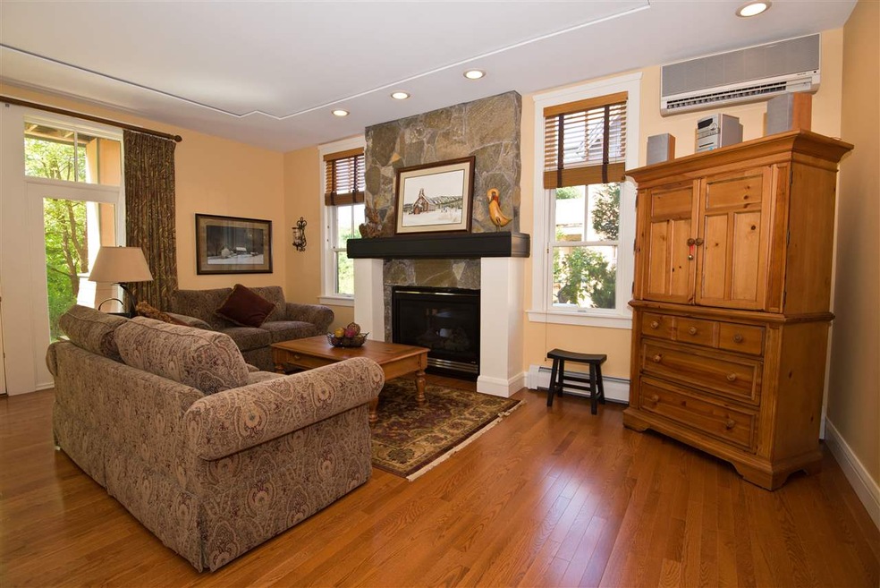 Condominium with custom glimmerstone fireplace