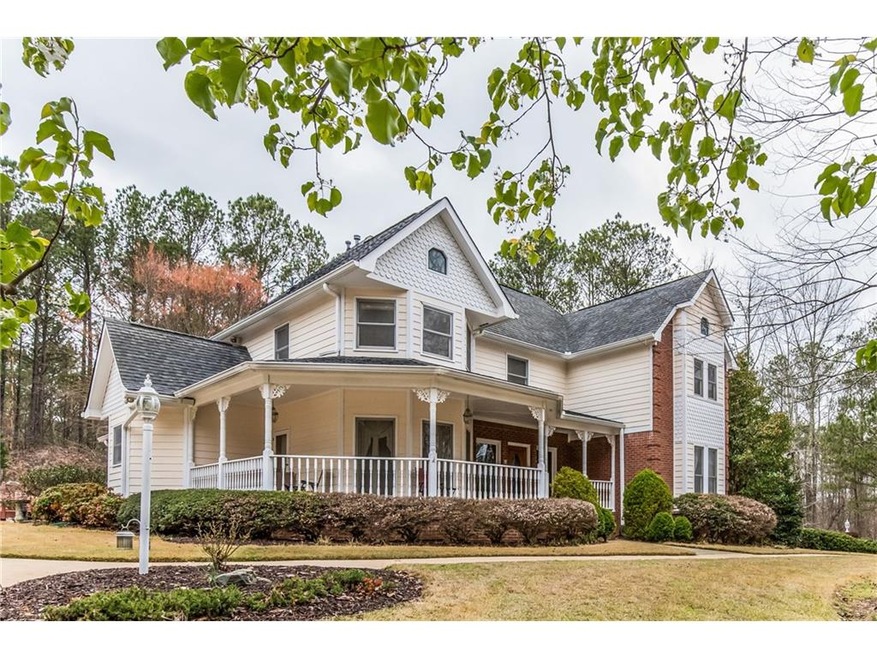 Nestled on 4 acres adjacent to a fully stocked pri