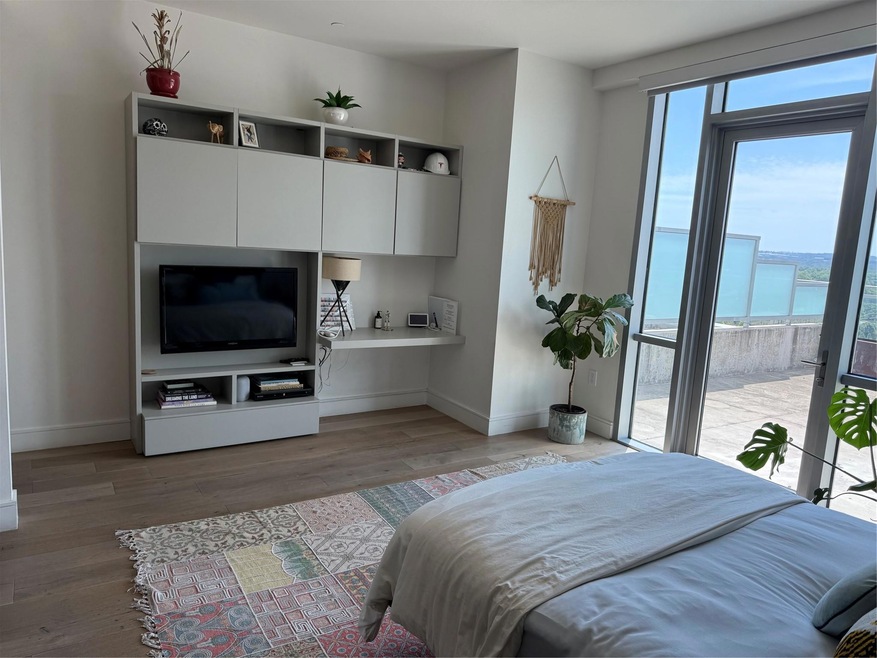 Bedroom featuring baseboards, light wood finished