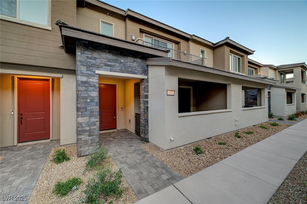 View of front of property featuring stone siding,