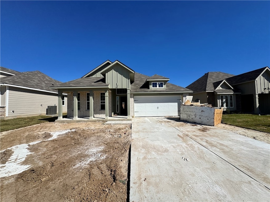 View of front of home featuring concrete driveway, board and batten siding, brick siding, a porch, and an attached garage