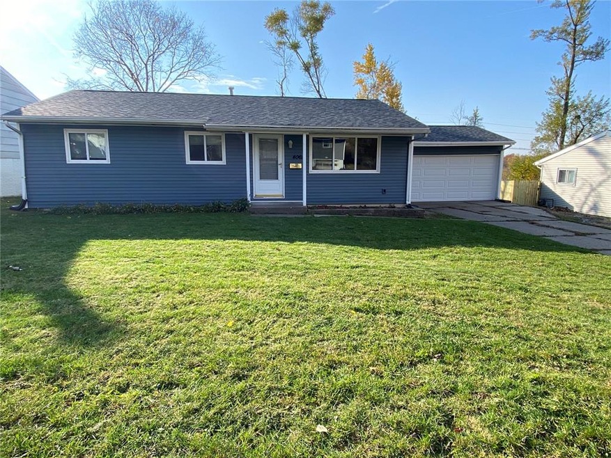 Large front yard and two car garage.
