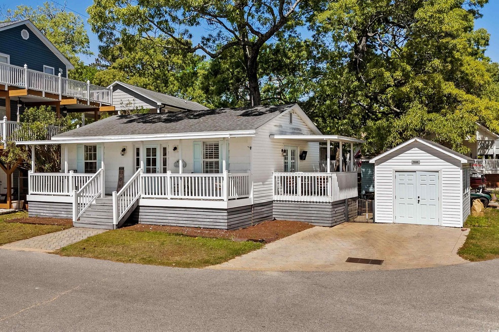 View of front of home with a storage unit, an outb