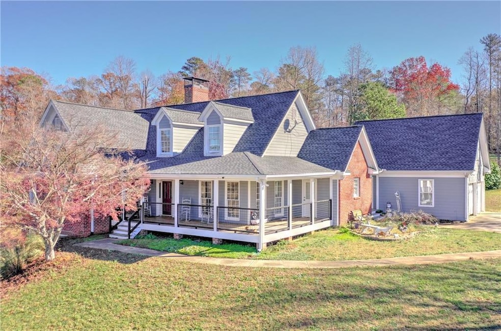 View of front of home with a front lawn and a wood
