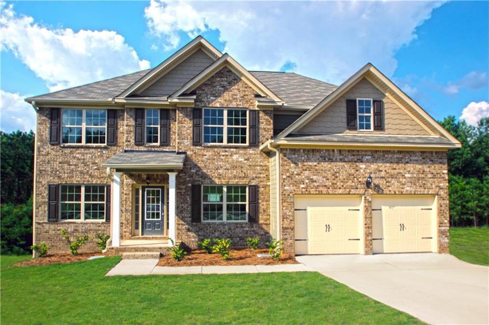 View of front facade with concrete driveway, a front yard, board and batten siding, a shingled roof, and brick siding