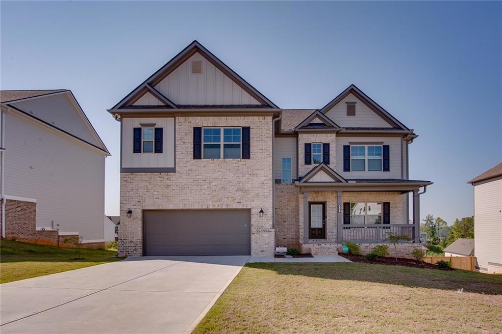 Craftsman house with a garage, a porch, and a fron