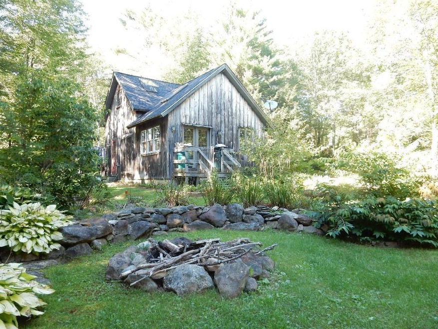 Nestled in 18+ Acres of woods