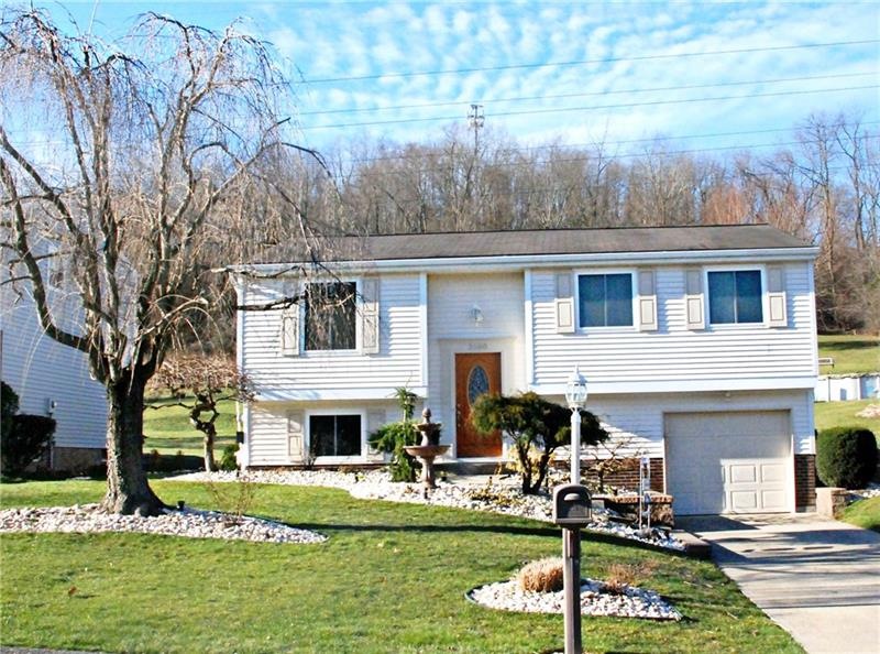 Gorgeous professionally landscaped exterior which 